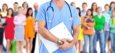 Medical Professional standing in front of a group of people